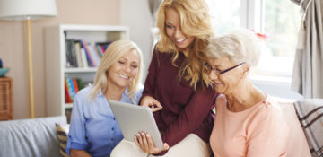 family looking at their tablet