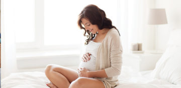 pregnant woman on bed